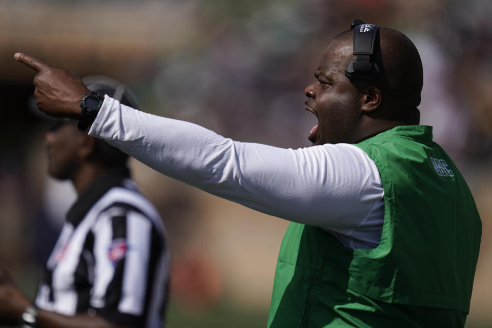 Marshall head coach Charles Huff yells to his team as they play against Notre Dame during the first half of an NCAA college football game in South Bend, Ind., Saturday, Sept. 10, 2022. (AP Photo/Michael Conroy)