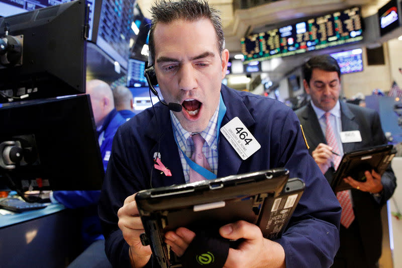 Traders work on the floor of the New York Stock Exchange (NYSE) in New York City, U.S., December 8, 2016. REUTERS/Brendan McDermid