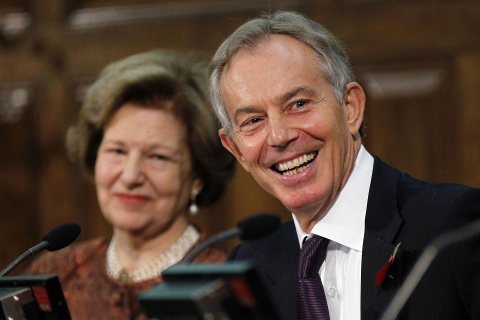 Former British Prime Minister Tony Blair, right, reacts to a media question after his speech to the delegates, at the Iraq Britain Business Council (IBBC) fourth annual conference in central London, Monday, Nov. 5, 2012. Baroness Nicholson, IBCC Executive Chairman is in the background. Former Prime Minister Tony Blair says British forces should be proud of their role in the U.S.-led invasion of Iraq, citing what he claimed is major progress made in the country since the toppling of Saddam Hussein in 2003. (AP Photo/Sang Tan, Pool)