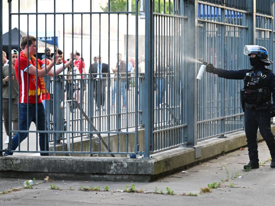 Police spray tear gas at Liverpool fans outside the stadium (Getty Images)