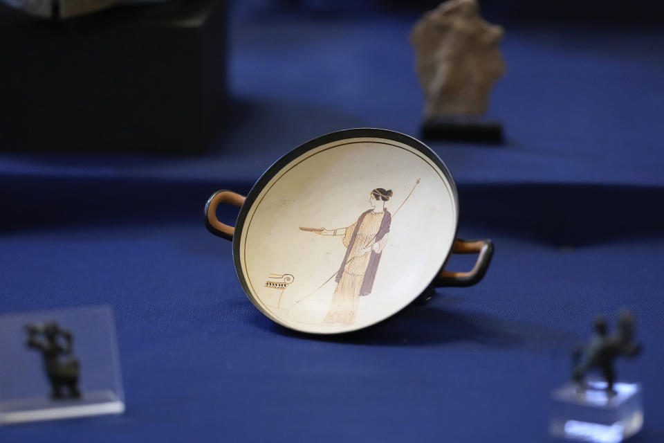 A Kylix dish, dated to the V century B.C., is seen on display among other archaeological artifacts stolen from Italy and sold in the US by international art traffickers, during a press conference in Rome, Monday, Jan. 23, 2023. 60 stolen artifacts, for an estimated total value of 20 million dollars, have been recovered in private collections in the US and returned to Italy after a joint investigation by Italian Carabinieri police and the New York County District Attorney's Office. (AP Photo/Andrew Medichini)