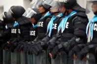 Riot police stand guard in front of German Embassy in Bangkok