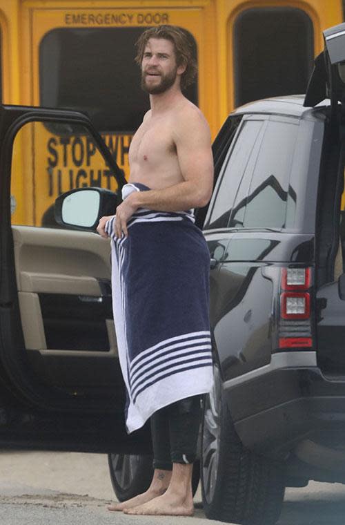 Liam Hemsworth strips off at the beach