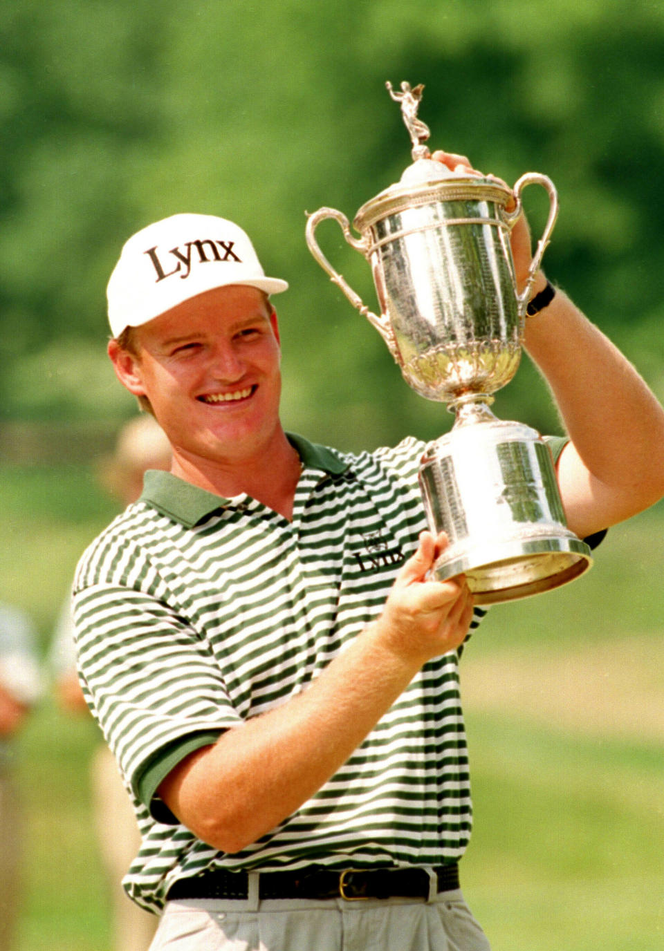 FILE - In this June 20, 1994, file photo, Ernie Els holds up his trophy after winning the U.S. Open golf tournament in Oakmont, Pa.. (AP Photo/Kathy Willens, File)