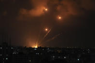 Rockets fired by Palestinian militants toward Israel are seen over Gaza City, Saturday, Aug. 6, 2022. The latest confrontation between Israel and Gaza militants is in its second day, as Israeli jets hit targets in Gaza and rocket fire persists into southern Israel. Palestinian officials say at least 15 people have been killed in Gaza, including a senior militant leader and a 5-year-old girl. (AP Photo/Adel Hana)