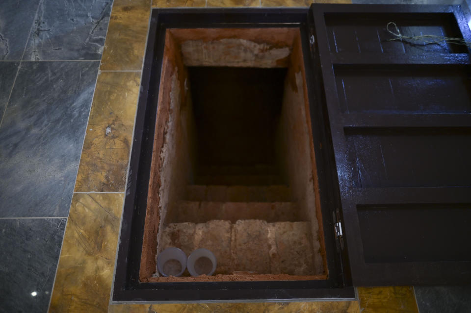 The entrance to a crypt stands in the middle of the altar inside the second oldest Spanish church in the Americas, the San Jose Church, that will reopen following a massive reconstruction that took nearly two decades to complete, in San Juan, Puerto Rico, Tuesday, March 9, 2021. “We let the church talk to you,” said architect Jorge Rigau, adding that people “will find witnesses, ghosts, memories, scars.” (AP Photo/Carlos Giusti)