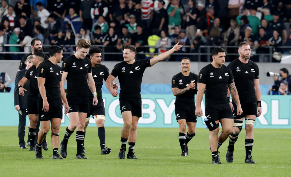 New Zealand's players acknowledge cheering fans after the Rugby World Cup quarterfinal match at Tokyo Stadium between New Zealand and Ireland in Tokyo, Japan, Saturday, Oct. 19, 2019. (AP Photo/Eugene Hoshiko)