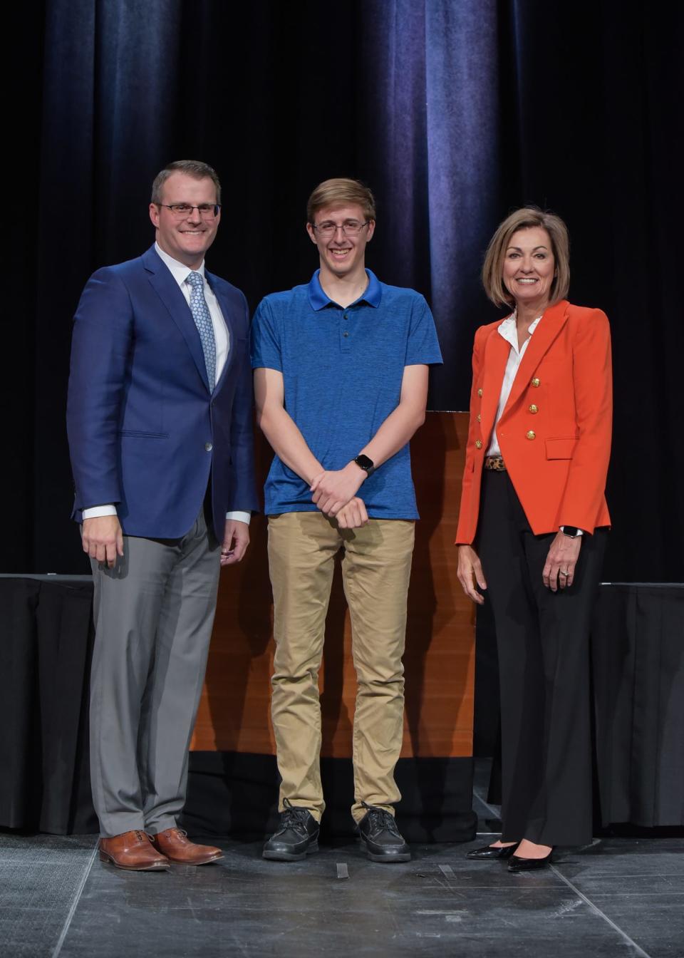 Carsten Wright of Woodward-Granger High School is recognized by Lt. Gov. Adam Gregg and Gov. Kim Reynolds during the Governor’s Scholar Recognition Ceremony on April 30.