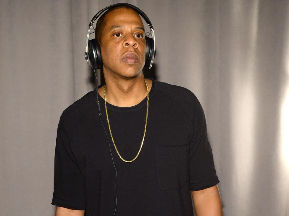 Jay Z wearing headphones wearing all black