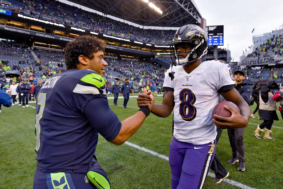 Russell Wilson and Lamar Jackson are two of the best quarterbacks remaining in the NFL playoffs. (Photo by Alika Jenner/Getty Images)