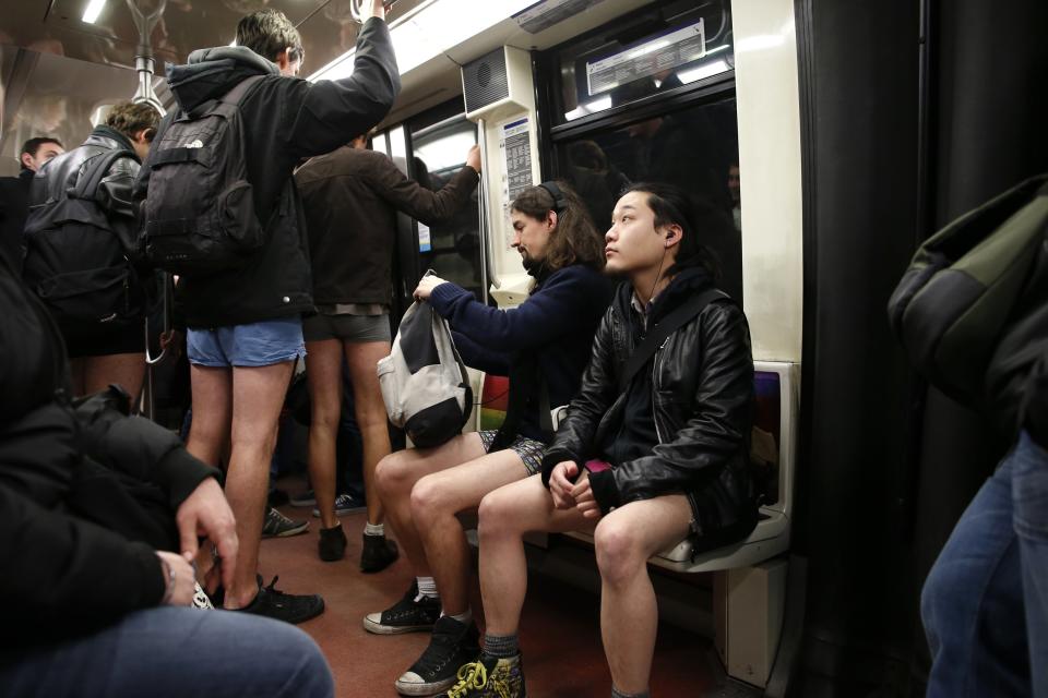 Passengers without their pants ride a subway train during the "No Pants Subway Ride" in Paris