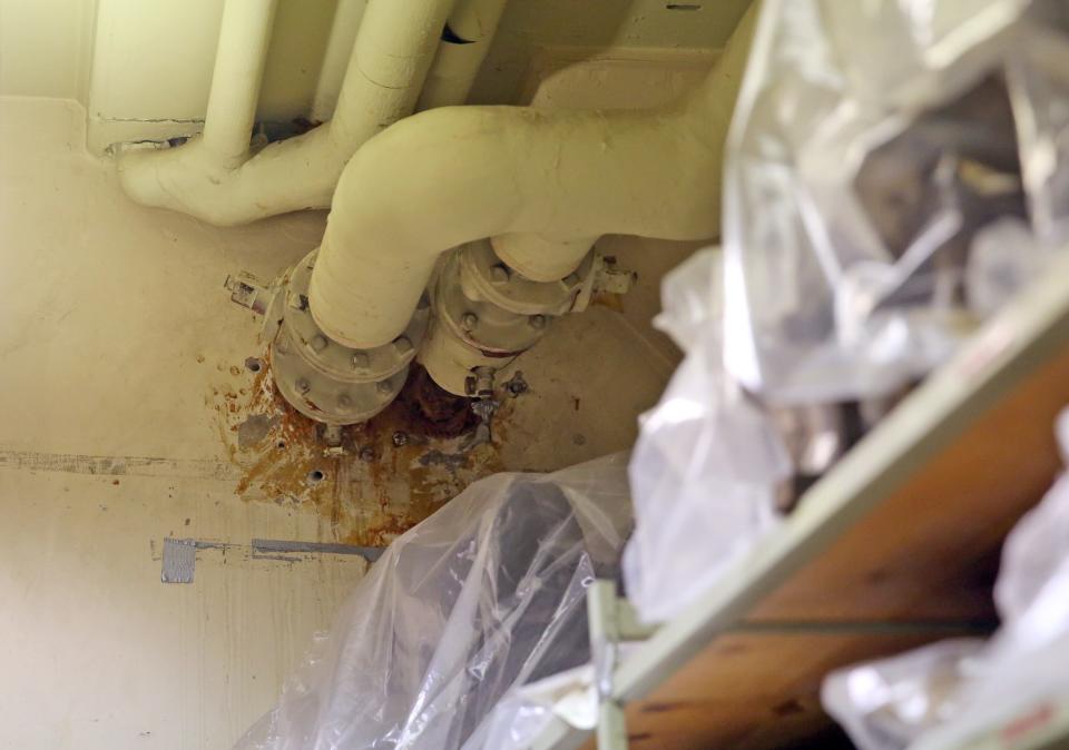 Pipes with water damage above shelves of artifacts are seen in the basement of the Milwaukee Public Museum, 800 W. Wells St., on May 20, 2015.