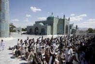 <b>MAZAR-E-SHARIF, AFGHANISTAN: </b>Afghan men pray at the Blue Mosque. Mazar-e-Sharif means "Noble Shrine", a reference to the large, blue-tiled mosque around which the town is built.