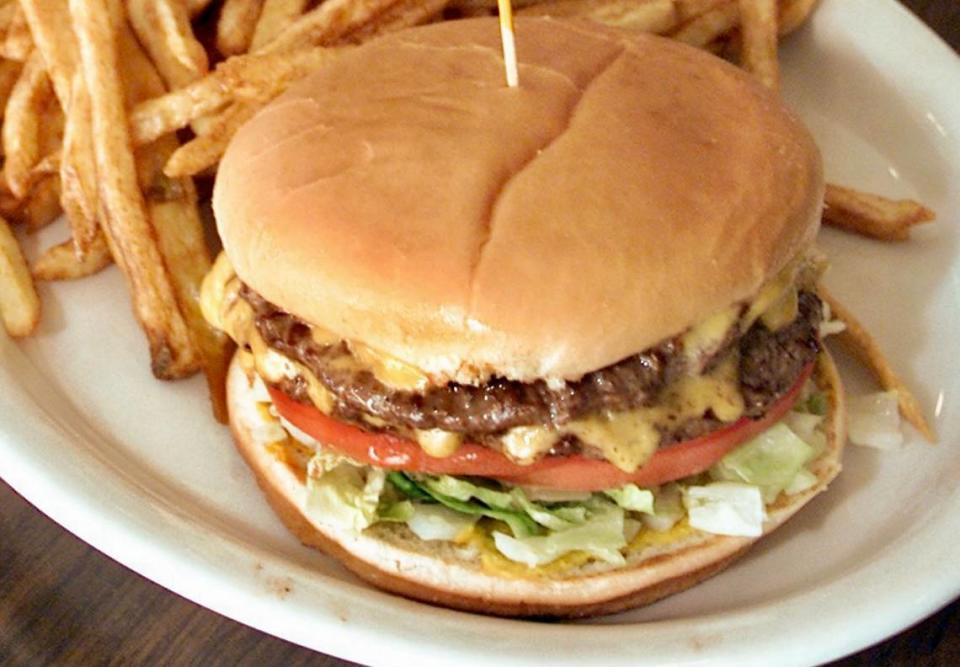 A double cheeseburger with french fries from Al’s Hamburgers in Arlington.