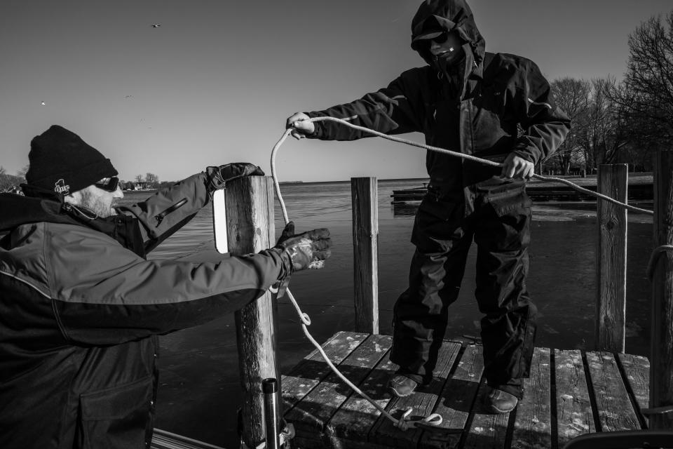 George Cini Sr. and George Cini Jr. take their boat out to fish on the waters of Lake Erie on Feb. 22. The air is frigid, but the water is mostly ice-free and open. (Photo: Amy Sacka for HuffPost)