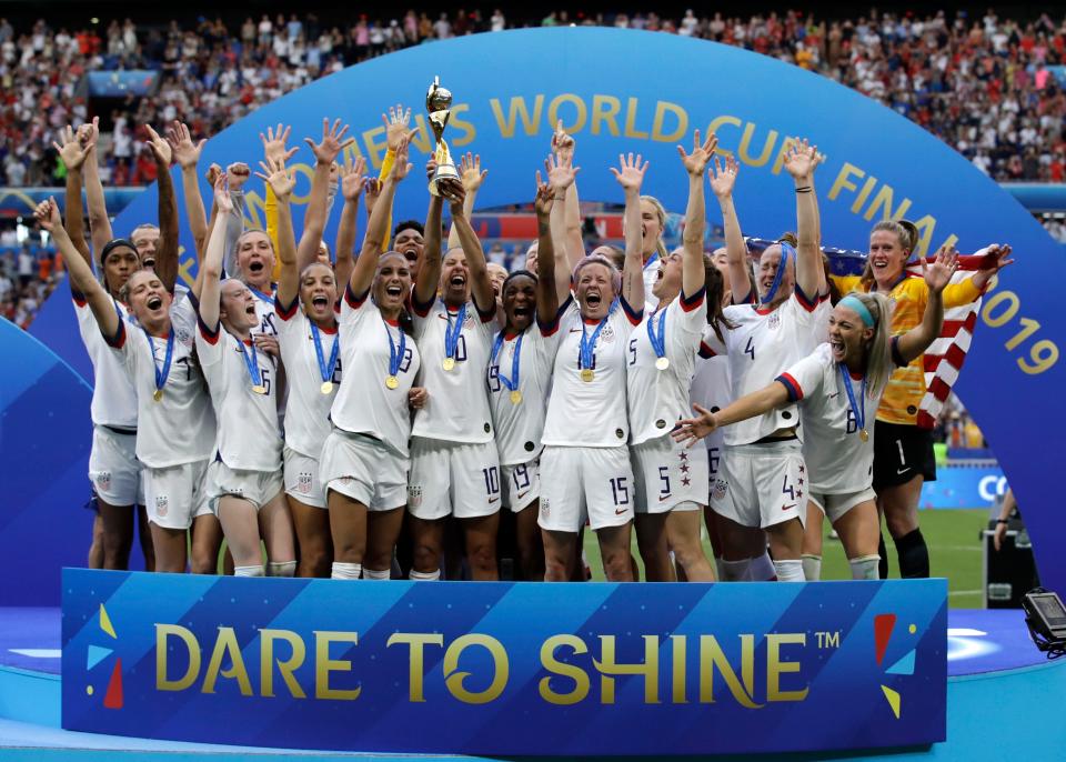 FILE - The United States team celebrates after winning the Women's World Cup final soccer match against The Netherlands at the Stade de Lyon in Decines, outside Lyon, France, Sunday, July 7, 2019. (AP Photo/Alessandra Tarantino, File)