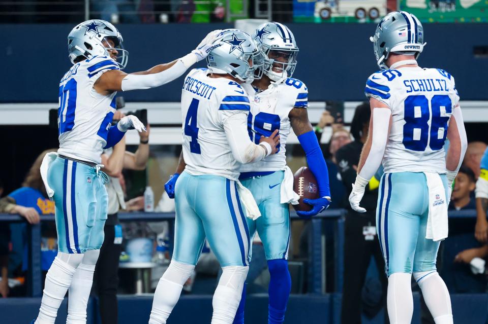 Dallas Cowboys wide receiver CeeDee Lamb (88) celebrates with teammates after scoring a touchdown  during the second half against the Philadelphia Eagles at AT&T Stadium.