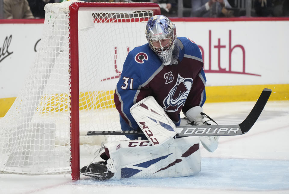 Colorado Avalanche goaltender Philipp Grubauer reacts after giving up a goal to Vegas Golden Knights right wing Alex Tuch during the third period of Game 5 of an NHL hockey Stanley Cup second-round playoff series Tuesday, June 8, 2021, in Denver. (AP Photo/David Zalubowski)