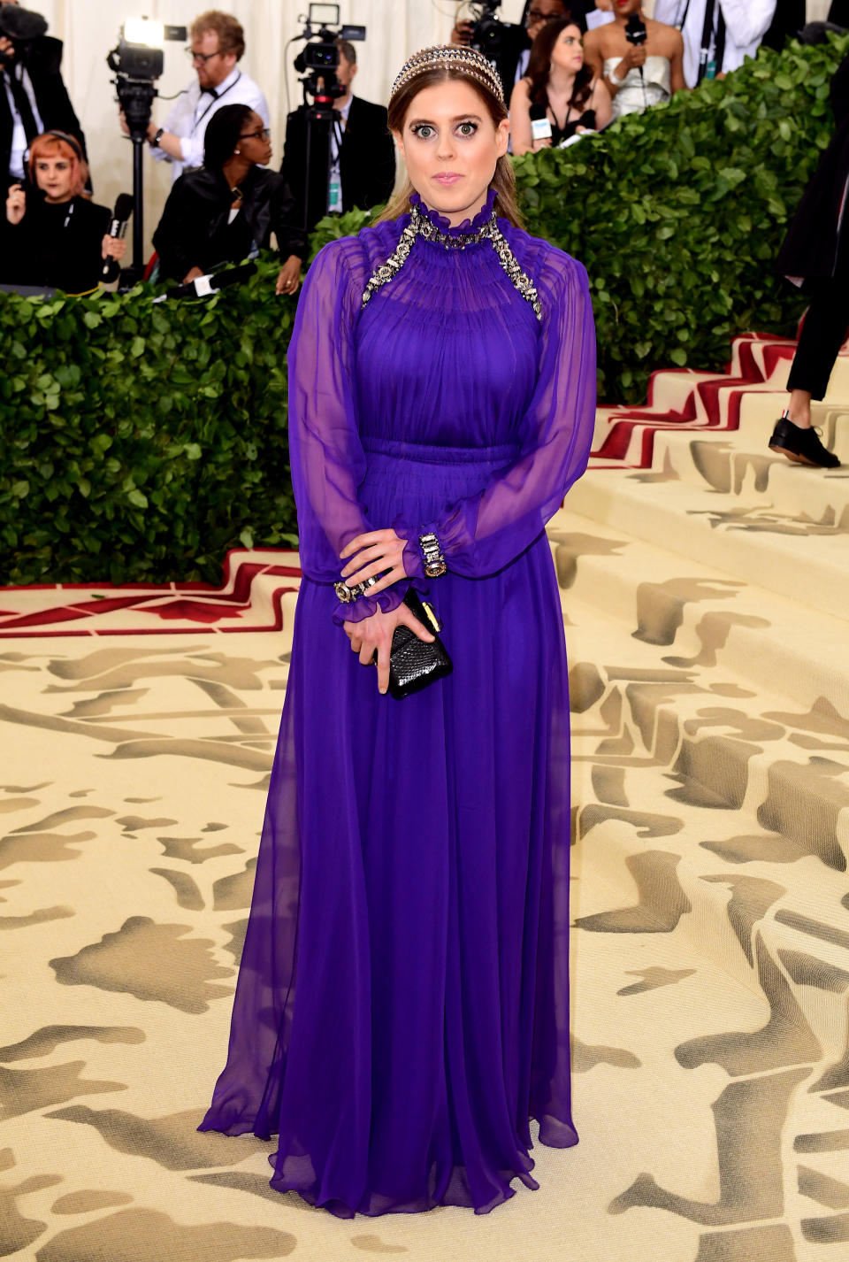 <p>Princess Beatrice surprised royal fans across the globe with her debut appearance at the 2018 Met Gala. The Queen’s granddaughter donned a regal purple dress accessorised with a ‘heavenly’ headpiece. Who needs a tiara when you can have a halo? <em>[Photo: Getty]</em> </p>