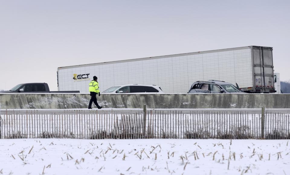 Emergency crews respond to a multi-vehicle accident in both the north and south lanes of Interstate 39/90 on Friday, Jan. 27, 2023, in Turtle, Wis. Authorities say snowy conditions led to the massive traffic pile-up in southern Wisconsin on Friday that left Interstate 39/90 blocked for hours. (Anthony Wahl/The Janesville Gazette via AP)