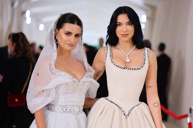 <p>Getty Images</p> Dua Lip and Penélope Cruz attend the 2023 Met Gala