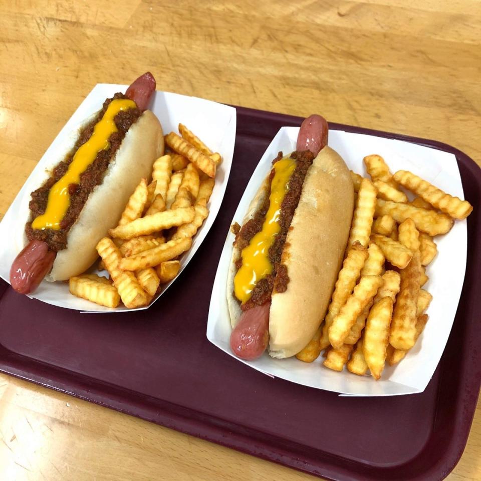 The All the Way dogs at The Hot Stop are incredibly popular. They're topped with chili sauce, bacon and cheese.