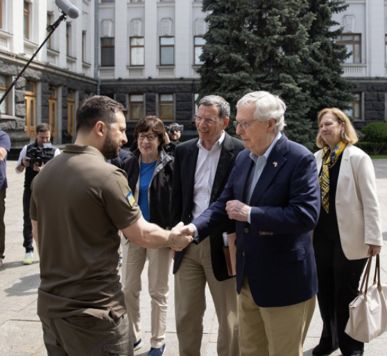 Zelensky and McConnell shaking hands