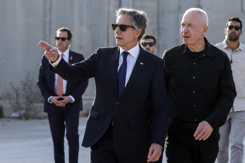 U.S. Secretary of State Antony Blinken walks with Israeli Defense Minister Yoav Gallant, right, at the Kerem Shalom border crossing in Kerem Shalom, Israel, Wednesday May 1, 2024. (Evelyn Hockstein/Pool Photo via AP)