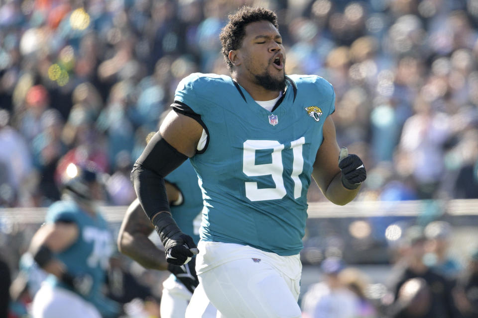 FILE - Jacksonville Jaguars linebacker Dawuane Smoot (91) runs on the field before an NFL football game against the Carolina Panthers, Sunday, Dec. 31, 2023, in Jacksonville, Fla. The Buffalo Bills announced the signings of Smoot, wide receiver Chase Claypool and linebacker Deion Jones to one-year contracts on Friday, May 3, 2024. (AP Photo/Phelan M. Ebenhack, File)