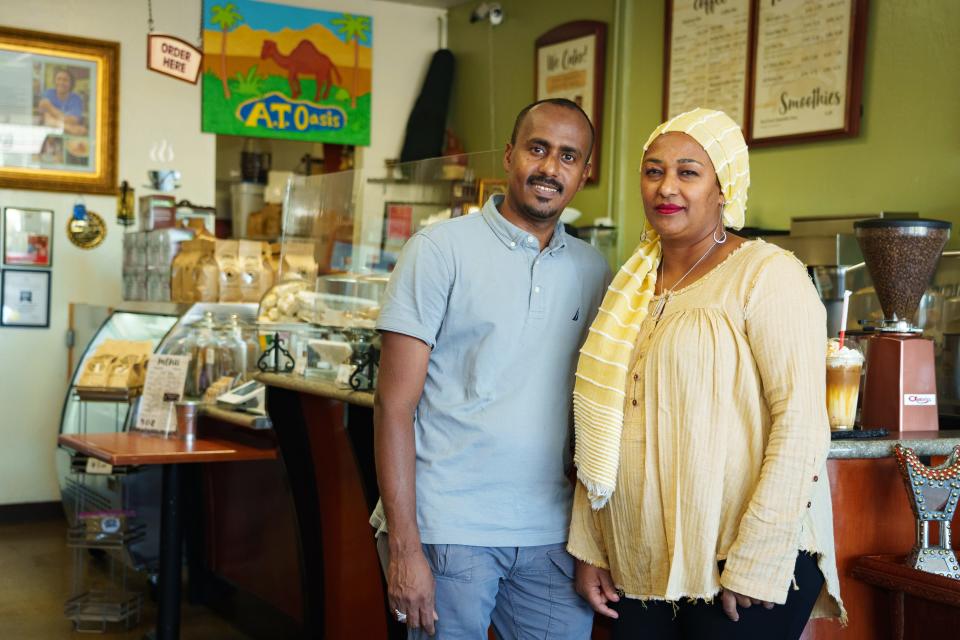 Owners, Abdul Muhammad, left, and Aisha Tedros, right, pose for a portrait at Oasis Coffee and Tea on Oct. 14, 2022 in Phoenix, AZ.