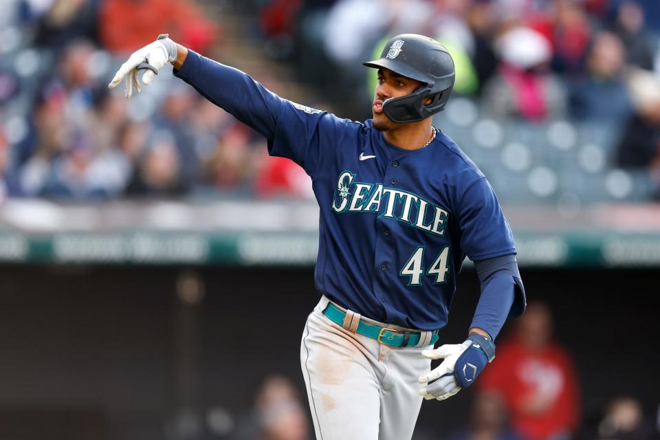 Mariners center fielder Julio Rodriguez celebrates as he rounds the bases after hitting a two-run home run off Guardians relief pitcher Nick Sandlin during the sixth inning, Friday, April 7, 2023, in Cleveland.