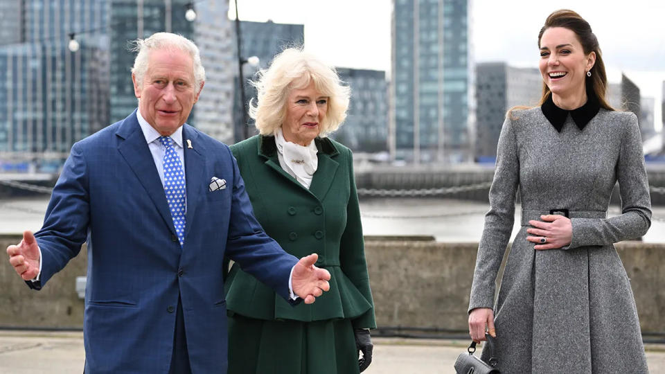 King Charles and Queen Camilla standing next to Kate Middleton outdoors