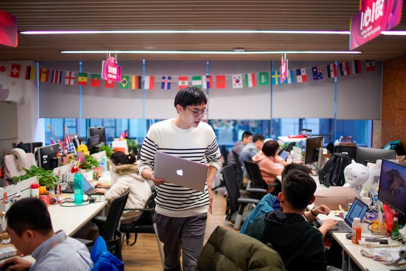 Employees work at AliExpress office at the Alibaba company's headquarters in Hangzhou