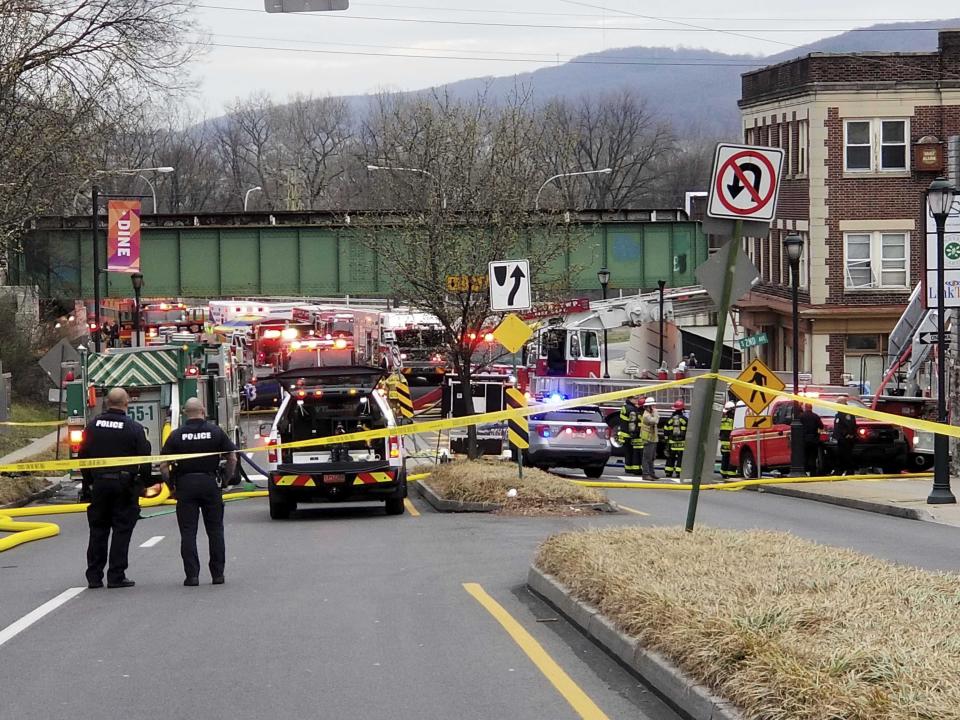 Emergency personnel work at the site of a deadly explosion at a chocolate factory in West Reading, Pa., Saturday, March 25, 2023. (Michelle Lynch/Reading Eagle via AP)