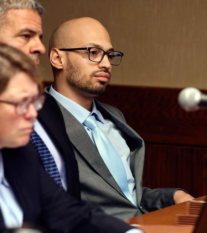 Sergio Correa, sits with his attorneys from the public defender&#39;s office in this file photo during a probable cause hearing in New London Superior Court Monday, July 22, 2019.
