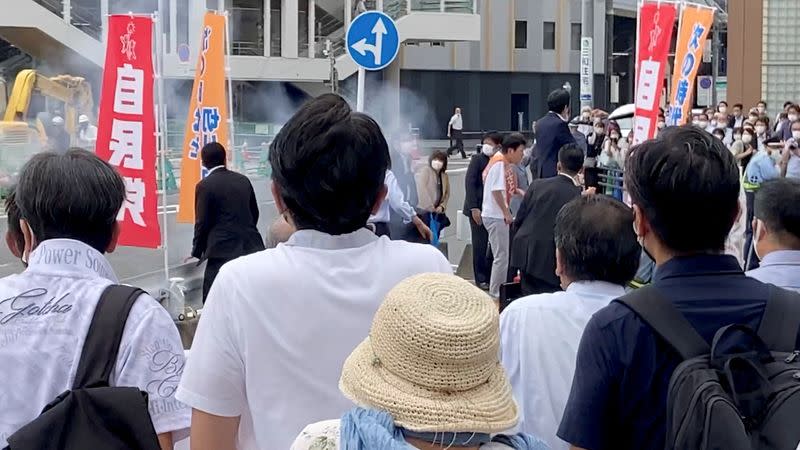 FILE PHOTO: A general view shows the first moment when a gunfire is shot while former Japanese PM Shinzo Abe speaks during an election campaign in Nara