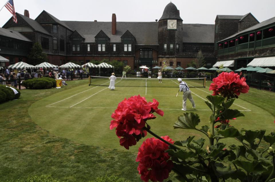 International Tennis Hall of Fame volunteers play an exhibition match in vintage clothing in 2015.