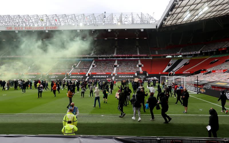 Manchester United fans protest against their owners before the Manchester United v Liverpool Premier League match