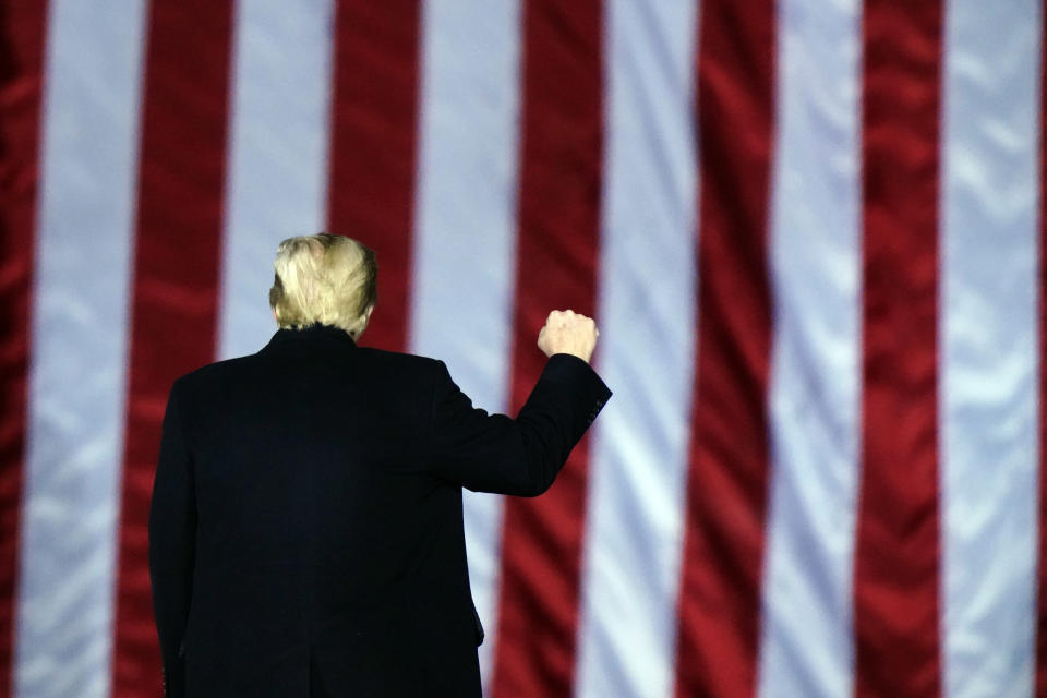 President Donald Trump gestures at a campaign rally in support of Senate candidates Sen. Kelly Loeffler, R-Ga., and David Perdue in Dalton, Ga., Monday, Jan. 4, 2021. (AP Photo/Brynn Anderson)