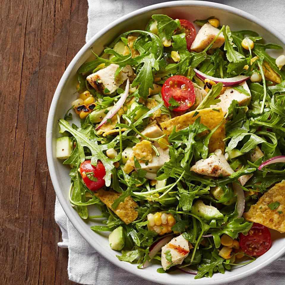 <p>Peppery arugula, grilled corn and a tangy lime vinaigrette give this healthy taco salad recipe a serious upgrade. This recipe is the perfect vehicle for using the crushed-up tortilla chips at the bottom of the bag. <a href="https://www.eatingwell.com/recipe/254619/grilled-chicken-taco-salad/" rel="nofollow noopener" target="_blank" data-ylk="slk:View Recipe;elm:context_link;itc:0;sec:content-canvas" class="link ">View Recipe</a></p>
