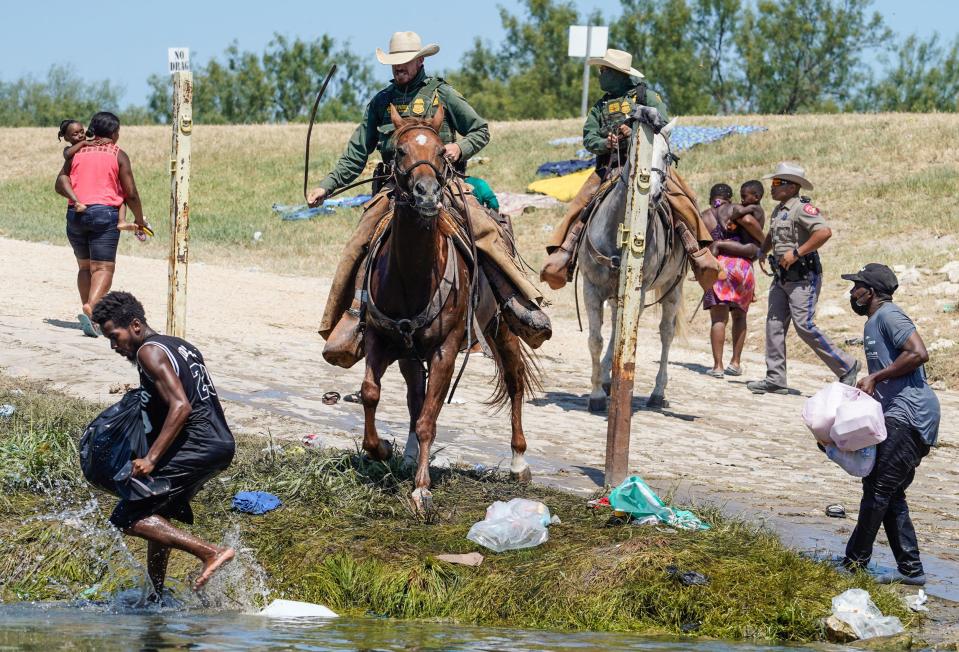 United States Border Patrol agents on horseback try to stop Haitian migrants from entering an encampment on the banks of the Rio Grande near the Acuna Del Rio International Bridge in Del Rio, Texas on September 19, 2021. / Credit: PAUL RATJE/AFP via Getty Images