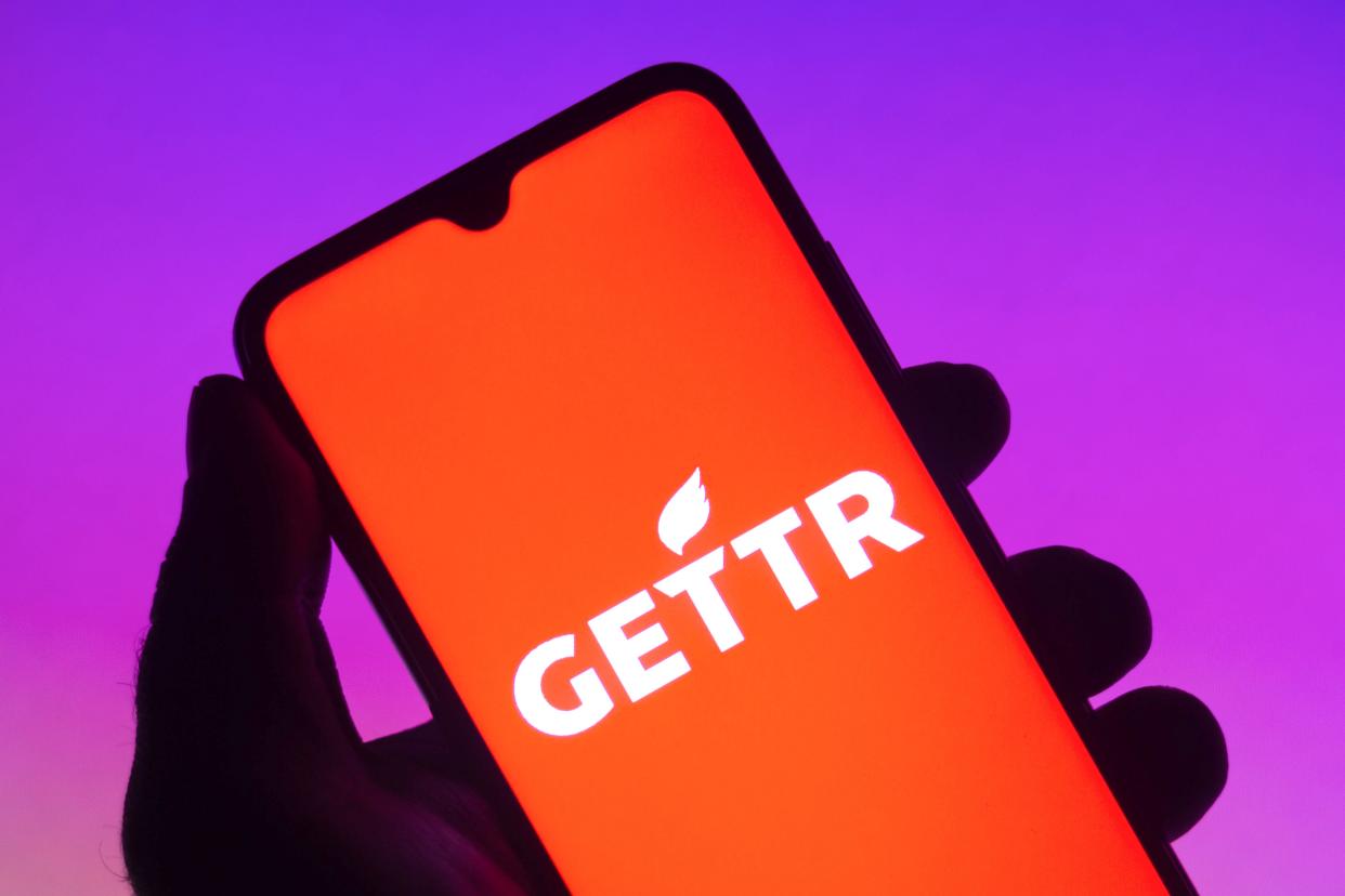 The Gettr logo is displayed on a smartphone