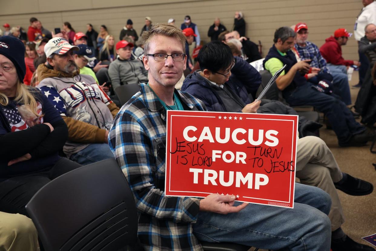 Guests attend a rally for former U.S. President Donald Trump on Dec. 19, 2023, in Waterloo, Iowa. <a href="https://www.gettyimages.com/detail/news-photo/guests-attend-a-campaign-event-hosted-by-republican-news-photo/1868318344?adppopup=true" rel="nofollow noopener" target="_blank" data-ylk="slk:Scott Olson/Getty Images;elm:context_link;itc:0;sec:content-canvas" class="link ">Scott Olson/Getty Images</a>