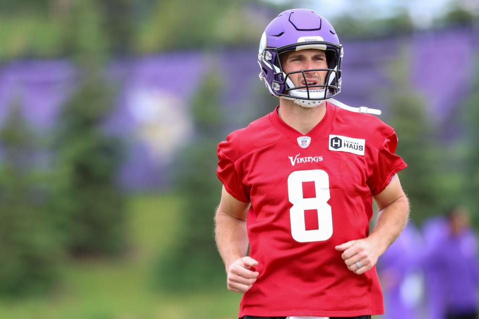 Minnesota Vikings quarterback Kirk Cousins (8) warmups up during mandatory mini camp at TCO Performance Center.