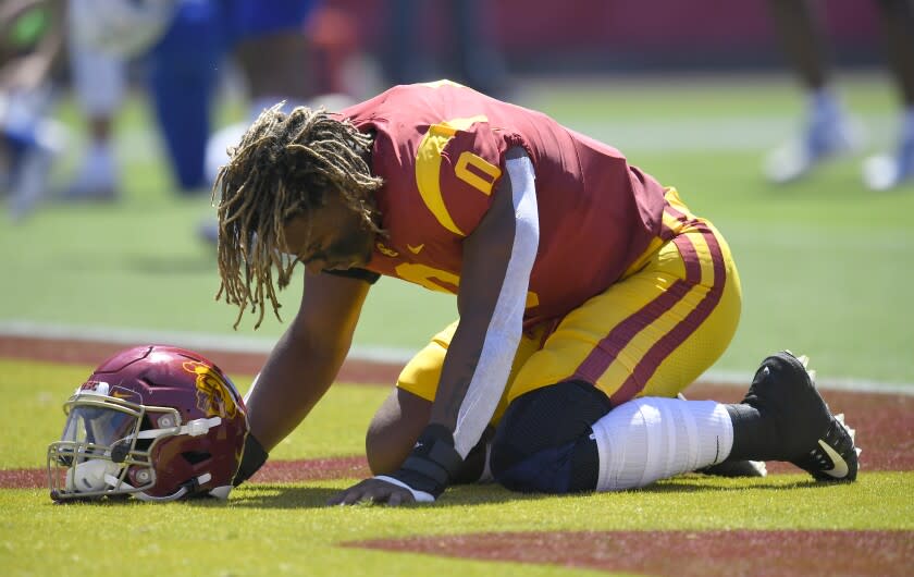 USC Trojans defensive lineman Korey Foreman kneels in the end zone before playing the San Jose State.