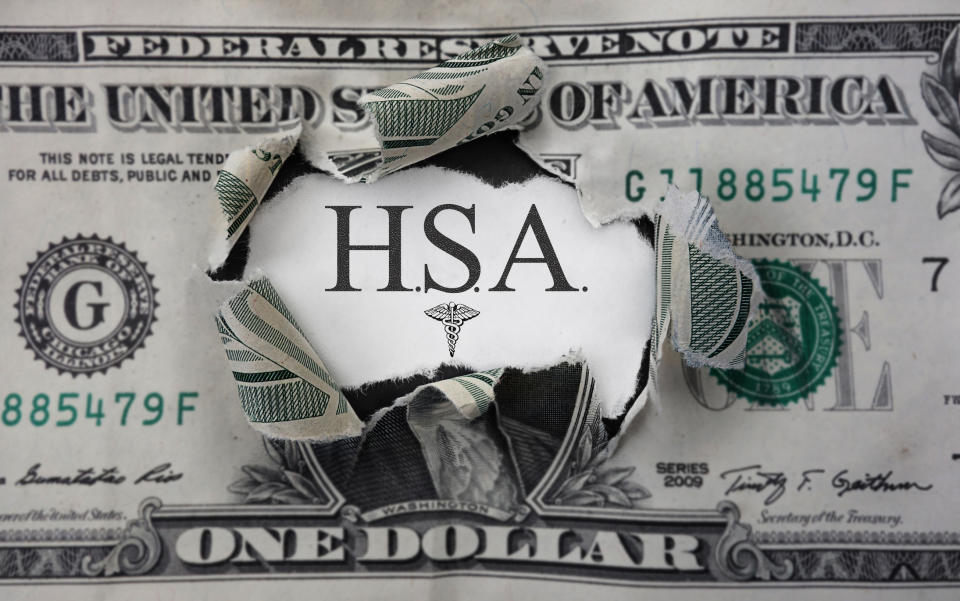 Dollar bill with hole in middle that says HSA