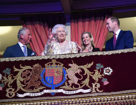 Britain's Queen Elizabeth waves next to Prince Charles and Prince William, Duke of Cambridge, during a special concert "The Queen's Birthday Party" to celebrate her 92nd birthday at the Royal Albert Hall in London, Britain April 21, 2018. Andrew Parsons/Pool via Reuters