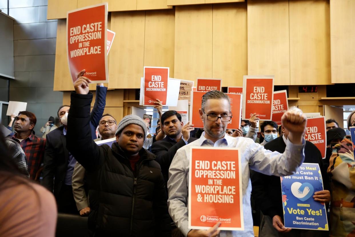 People react to discussion of the ordinance to add caste to Seattle's anti-discrimination laws on Tuesday, Feb. 21, 2023, in Seattle. The Ontario Human Rights Commission has now published a policy addressing caste-based discrimination.  (AP Photo/John Froschauer - image credit)