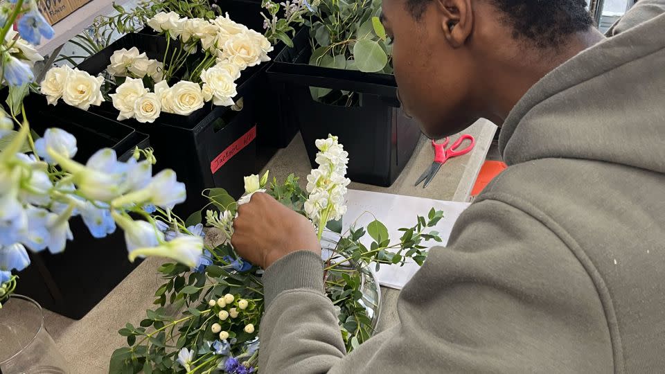 A Southside Blooms participant works on a floral arrangement. - Courtesy Southside Blooms