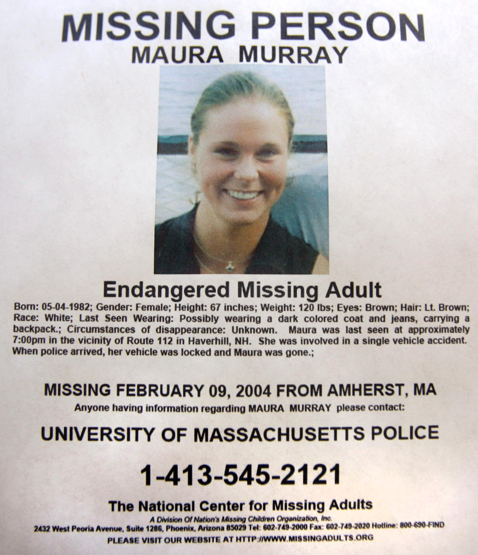 FILE - This Feb. 4, 2014 photo shows a missing person poster of Maura Murray that hangs in the lobby of the police station in Haverhill, N.H. Authorities are in an area of the northern New Hampshire town on Wednesday, April 3, 2019, related to an ongoing investigation into her disappearance in 2004. (AP Photo/Jim Cole, File)